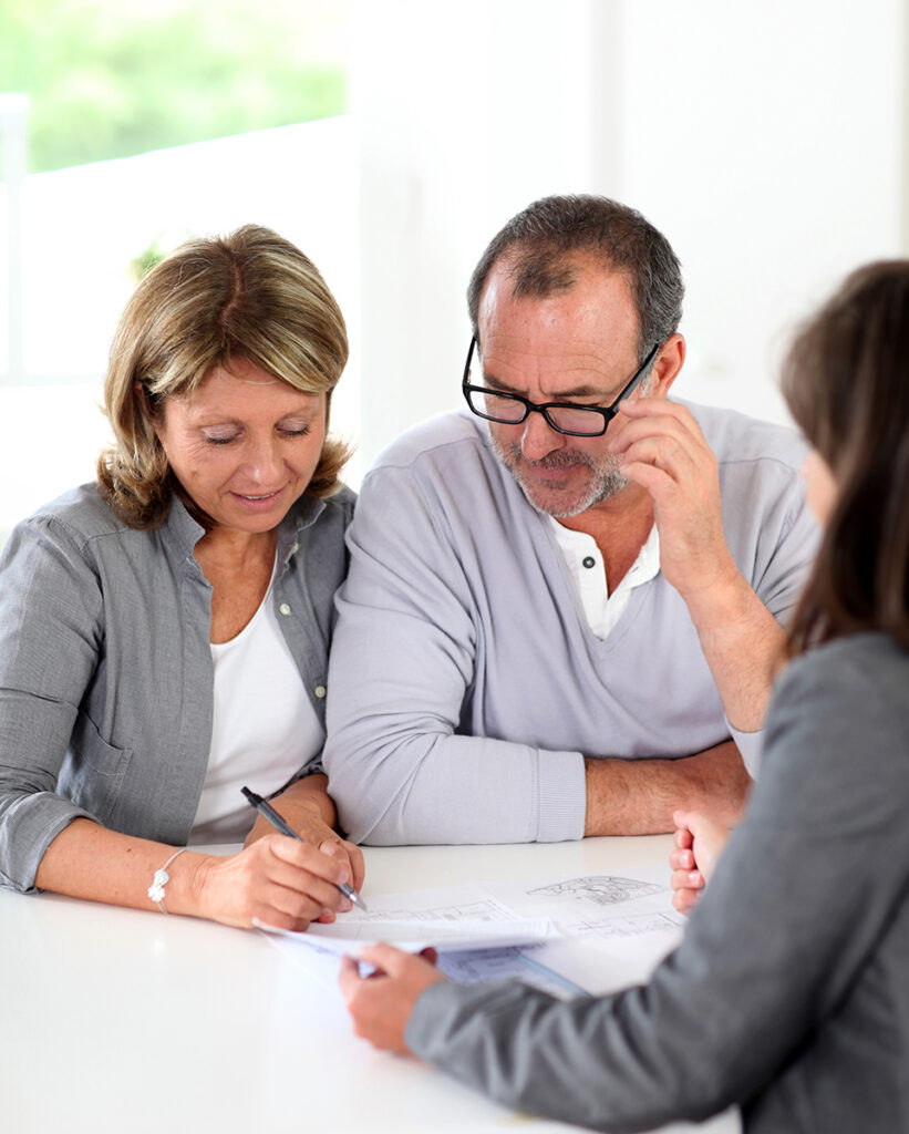 Senior couple looking at retirement papers